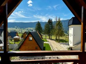 a view from a window of a house and a building at Holiday home Krajina I in Vlasic