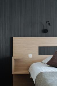 Cosmopolite Hotel Nieuwpoort-Badにあるベッド