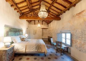 Postel nebo postele na pokoji v ubytování Palazzo Boyl 1840