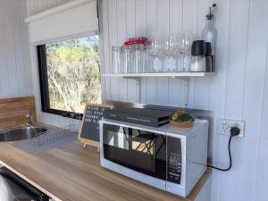 a microwave oven sitting on a counter in a kitchen at Hill River Nature Reserve in Jurien Bay