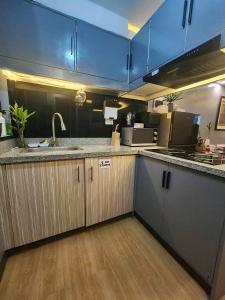 a kitchen with a sink and a counter top at melfaidy staycation in Imus
