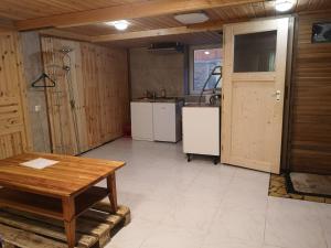 a large kitchen with a table and a sink at Apartment /flat in Schwebheim