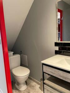 a bathroom with a toilet and a sink at Le studio urbain qu’il vous faut ! in Saint-Dizier