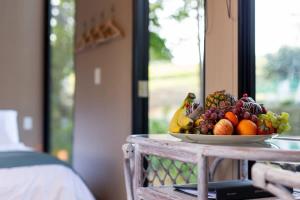 a bowl of fruit on top of a table at Forest Hill Farm in Herbert