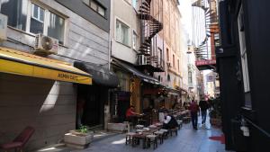 a city street with people walking down a street at Simon Hotel in Istanbul