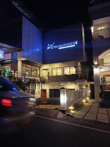 a building with aania sign on it at night at Silver Munnar in Munnar