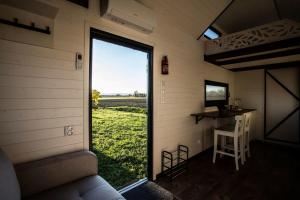 a view from the inside of a tiny house with a window at Dolce Casa 2 in Rigutino