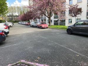 a parking lot with a bunch of cars parked at 5 minutes metro free parking 2 bedrooms 4-6P Near Paris in Malakoff