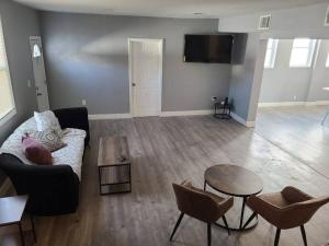 a living room with a couch and a table at Spacious Retreat in Carbondale