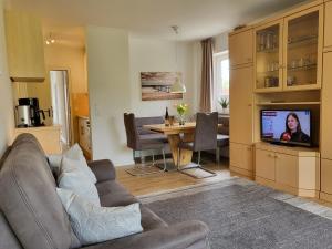 TV a/nebo společenská místnost v ubytování Apartment 74 im Haus Villa Anna II