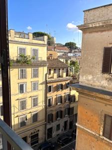a view from the window of a building at Trevi over the top apartment in Rome +3 photos
