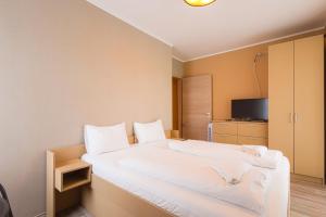 Postel nebo postele na pokoji v ubytování LIDO Apartmanok By BLTN Balatonlelle
