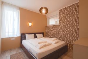 Postel nebo postele na pokoji v ubytování LIDO Apartmanok By BLTN Balatonlelle