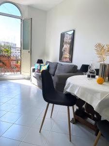 a living room with a table and a couch at Trevi over the top apartment in Rome