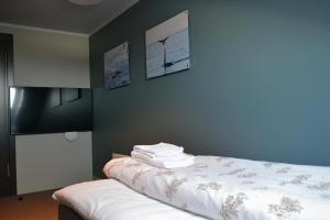 Postel nebo postele na pokoji v ubytování Andenes Suitehotel