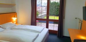 Postel nebo postele na pokoji v ubytování Alpenhotel Gastager