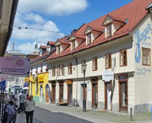 a group of buildings on a city street at Jager Apartments Tour As Ljubljana in Ljubljana