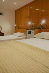 Tempat tidur dalam kamar di Mako´s Hotel