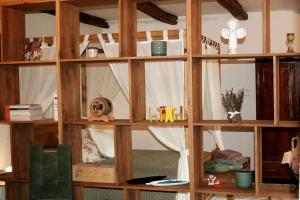 a wooden shelf with a window in a room at Il-Veduta: Country-estate in Oroslavje