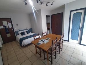 Posteľ alebo postele v izbe v ubytovaní Latre frères Location