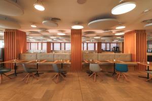a dining room with wooden tables and chairs at Don Gregory by Dunas - Adults Only in San Agustin