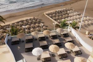 an overhead view of a beach with chairs and umbrellas at Don Gregory by Dunas - Adults Only in San Agustin
