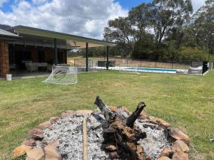a fire pit in the backyard of a house at The Residence - Ironstone Estate Hunter Valley in Lovedale