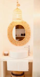 a bathroom with a mirror and a sink at Can Roca - Modern & Stylish Villa in Sant Ferran de Ses Roques +21 photos