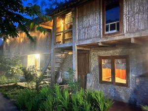 a house with a staircase leading up to it at PuBin Spice Hills in Hòa Bình