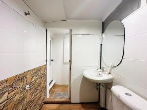 a bathroom with a sink and a mirror at Chubby 5 Room 4 in Ban Bang Bamru +8 photos