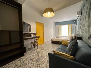 a living room with a couch and a bedroom at My Travel House in Rabat