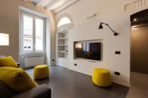Televízia a/alebo spoločenská miestnosť v ubytovaní Brera Apartments in Moscova