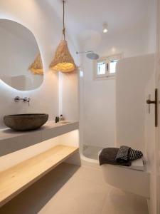 a bathroom with a sink and a shower at Parikia Cove Mansion in Parikia