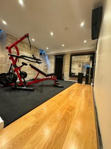 a room with a gym with a exercise bike at Hotel Peyris Opera in Paris