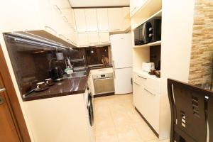 Kuchyň nebo kuchyňský kout v ubytování Апартамент за гости Уют + 4 fotografie