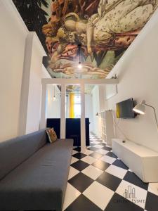 a living room with a ceiling with a painting at 5Seasons Apartments Krakow Center in Krakow
