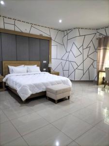 Cama ou camas em um quarto em Mpatsa Quest Hotels