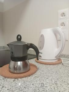 a tea kettle on a counter next to a toaster at Casa Siempreviva in Teguise