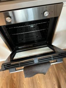 a oven with two lights on top of a wooden floor at Luxury Studio Apartment by Central Stay in Liverpool