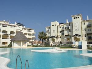 a large swimming pool in front of some buildings at Apartamentos Residencial Duquesa in San Luis de Sabinillas