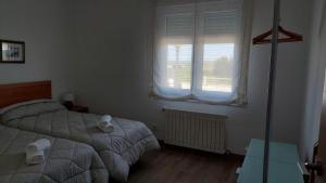 Łóżko lub łóżka w pokoju w obiekcie Casa José