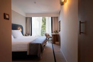 Кровать или кровати в номере Hotel Croatia