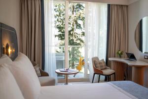 Кровать или кровати в номере Hotel Croatia