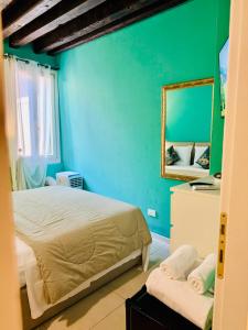 Un pat sau paturi într-o cameră la First Dream Venice
