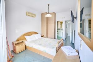 A bed or beds in a room at The Mardim Villa