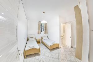 A bed or beds in a room at The Mardim Villa