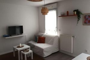 A seating area at Charmant appartement cosy et paisible proche Paris et aéroports