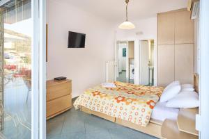A bed or beds in a room at The Mardim Villa