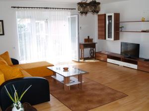 a living room with a couch and a coffee table at Apartment Marijana, Free Parking in Selce