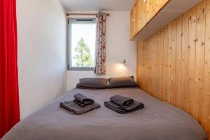 Säng eller sängar i ett rum på Les Marmottes